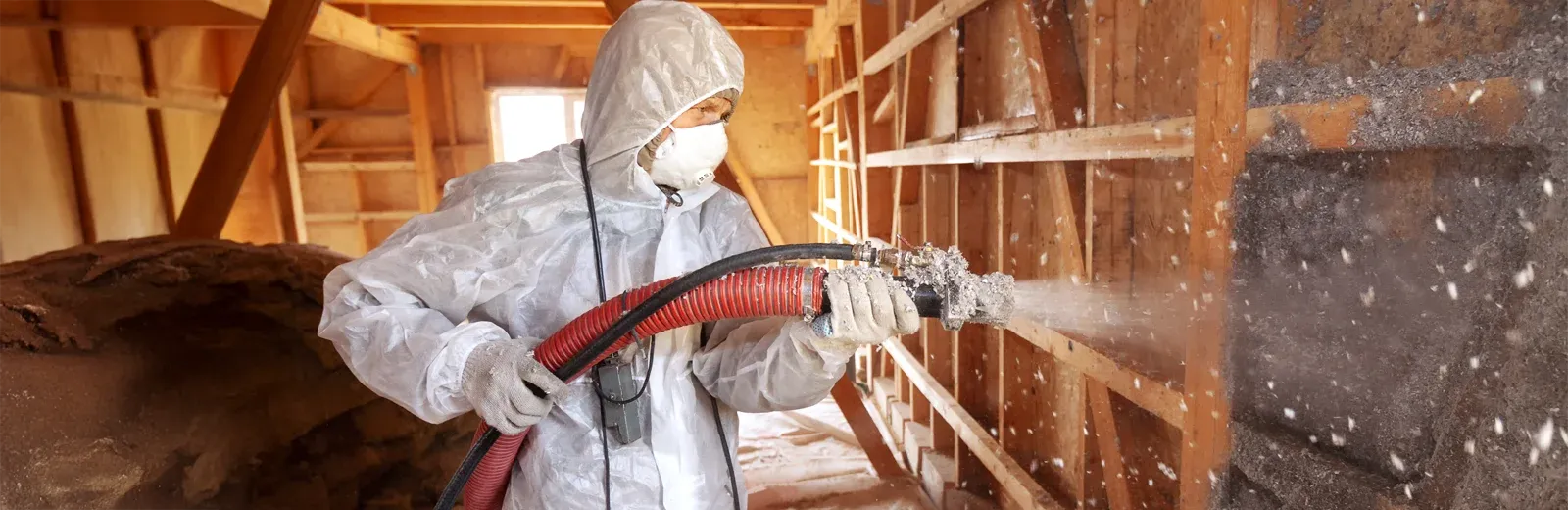 technician spraying insulation