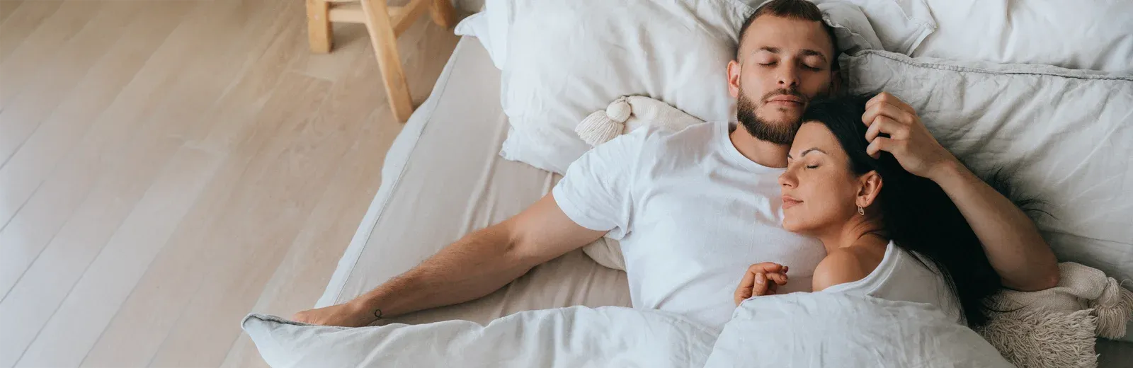 couple sleeping peacefully in bed